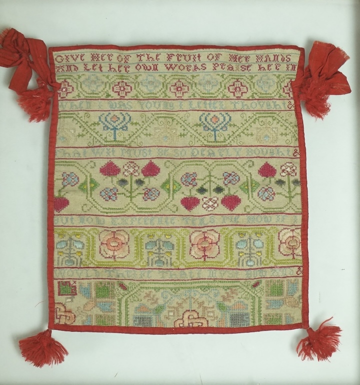 A 18th century long cross stitch sampler, converted later in the early 19th century into a bible bag and then later framed. The sampler worked in rows of alternate religious verse and floral embroidery. The sampler then